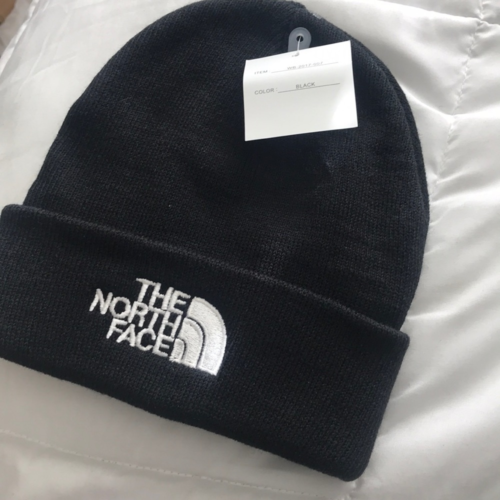 White & Black North Face Beanies EACH BEANIE $15